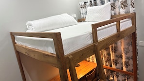 A bunk bed with white bedding and a wooden frame. - Siku Lodge (Arusha)