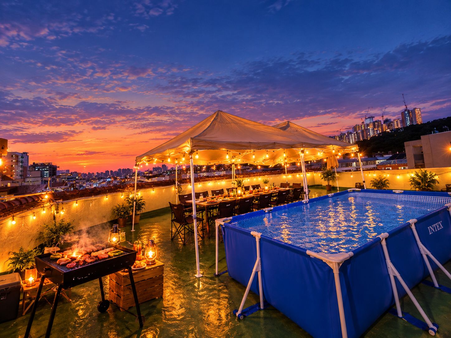 A rooftop dining area with a pool, tables, and a grill.