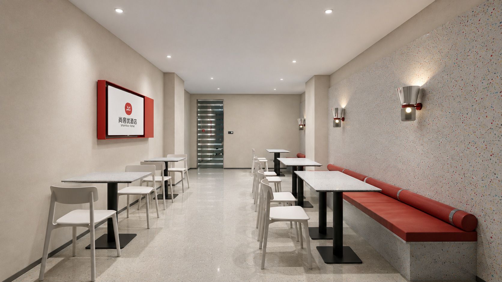 Un moderno vestíbulo de hotel con una larga recepción, varias mesas y una zona de estar con bancos.
