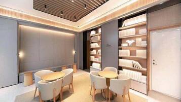 A modern interior with a central seating area, bookshelves, and a closed door.
