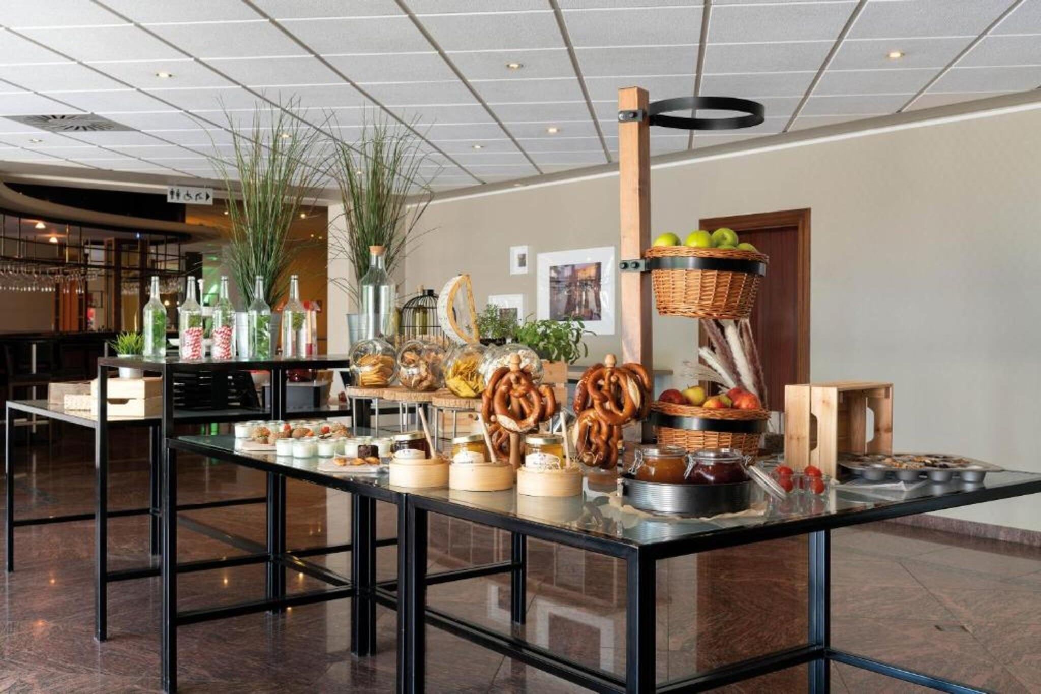 A buffet setup with various food items and beverages.