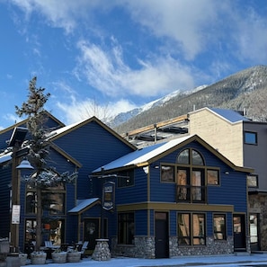 A hotel with a blue facade, large windows, and a sign indicating it is a hotel. - Hotel Frisco Colorado (Frisco)