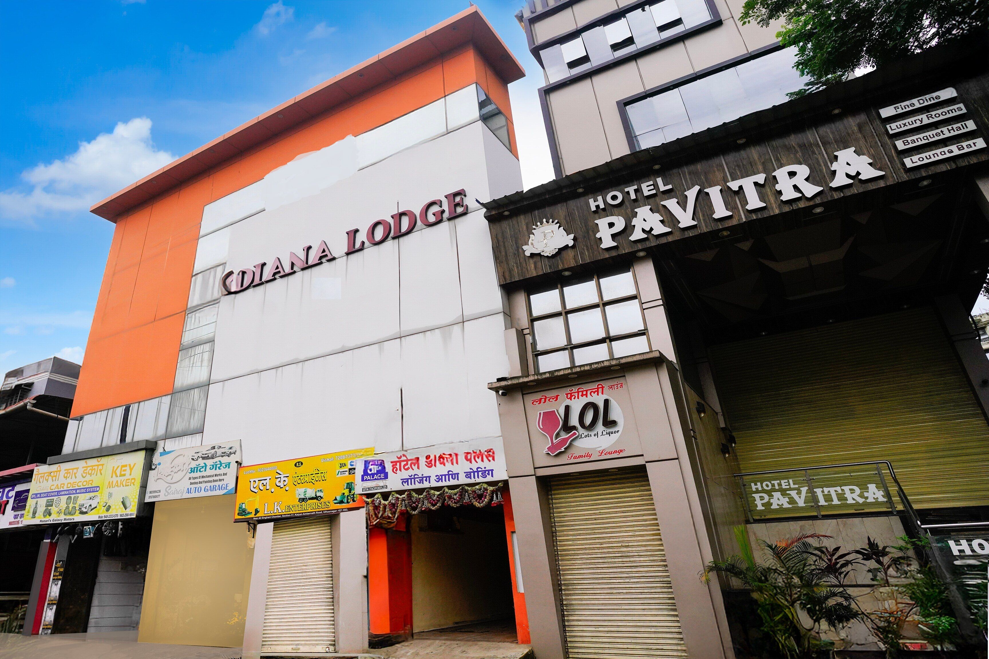 A hotel named 'DIANA LODGE' with signs for 'HOTEL PAVITRA' and 'LOL Family Lounge' visible.