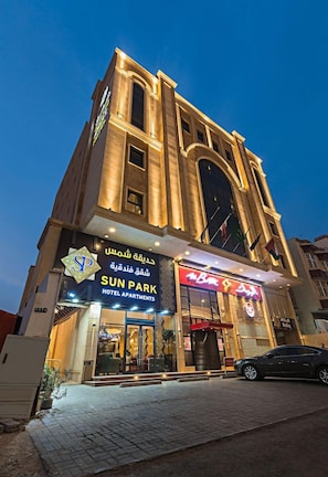 A hotel with a prominent sign for 'Sun Park Hotel Apartments' and a visible entrance. - Sun Park Hotel Apartments (Jeddah)