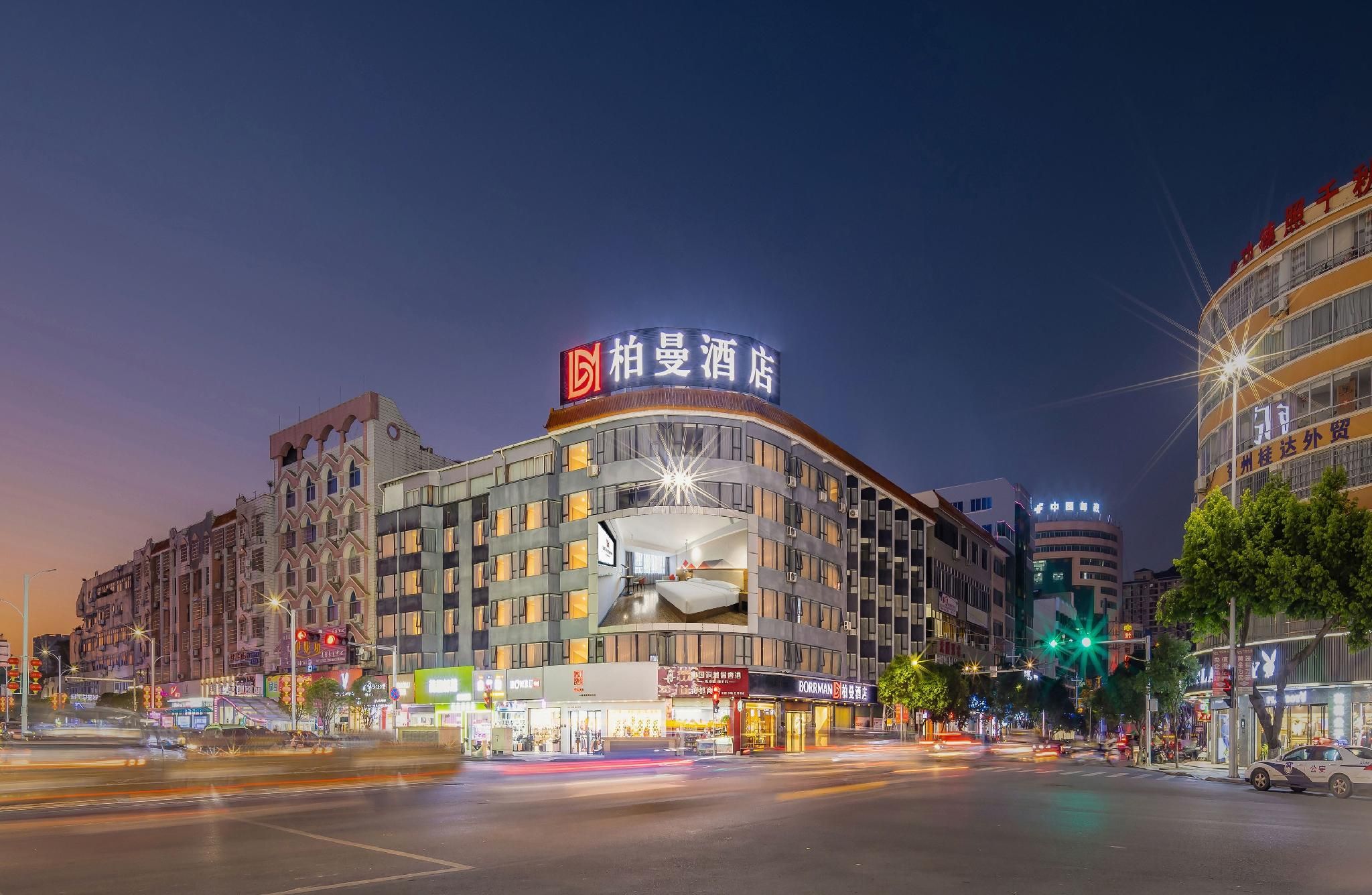 A hotel with a prominent sign, multiple floors, and a modern design.