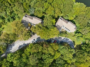 An aerial view of a residential area with two houses and a parking lot. - Villa Diane | Mountain view close to Ozone Falls! (Crab Orchard)