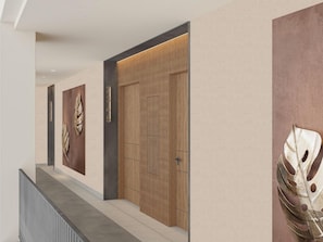 A hallway with a modern design, featuring a wooden door and wall-mounted artwork.
