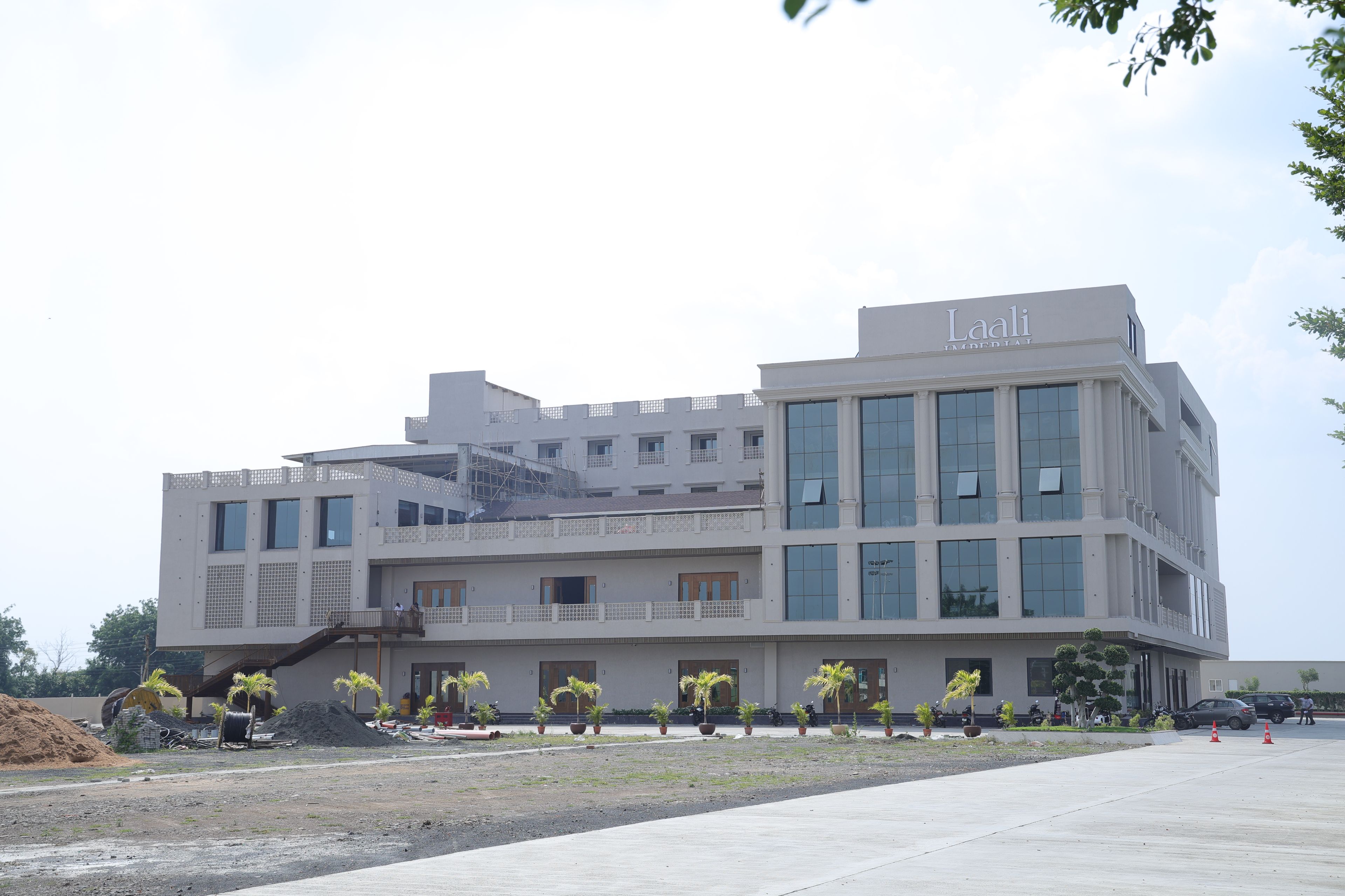 A multi-story building with a prominent sign reading 'Laali Imperial.'