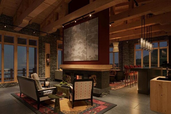 A spacious living area with a fireplace, seating, and large windows.