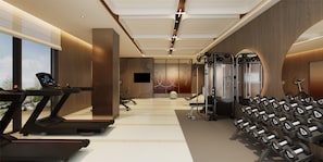 A modern gym with treadmills, a stationary bike, a rowing machine, and a wall of dumbbells. - Hilton Garden Inn Lanzhou Anning (Lanzhou)