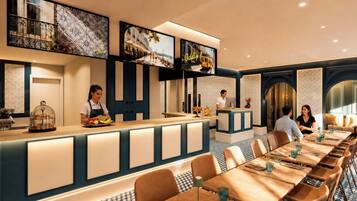 A restaurant with a long counter, multiple seating areas, and a television screen displaying a cityscape.