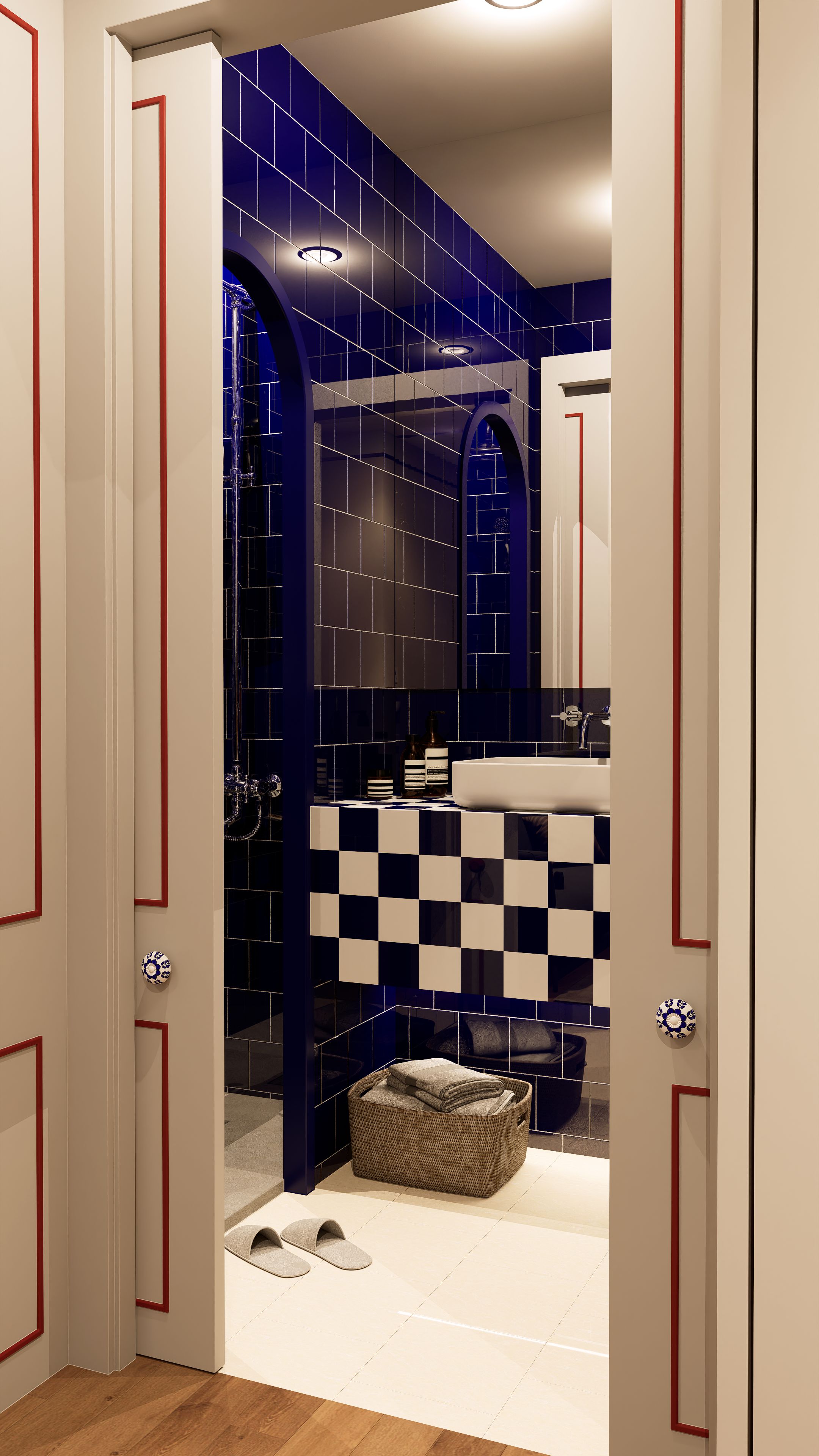 A modern bathroom with a checkered tile wall, a sink, and a shower area.