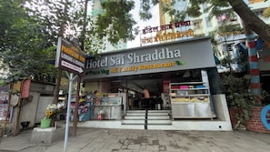 A hotel with a signboard indicating it is a family restaurant.