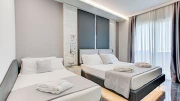 A hotel room with two beds, a nightstand, a wall-mounted control panel, and a large window with curtains.