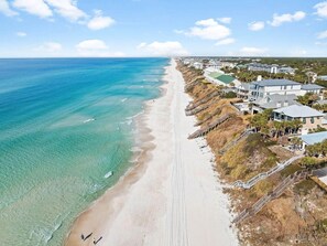 A coastal property with a beachfront, a wooden walkway, and a series of buildings. - Sea Rest | Private Pool | Deeded Beach Access | 3 King Suites (Watersound Beach)