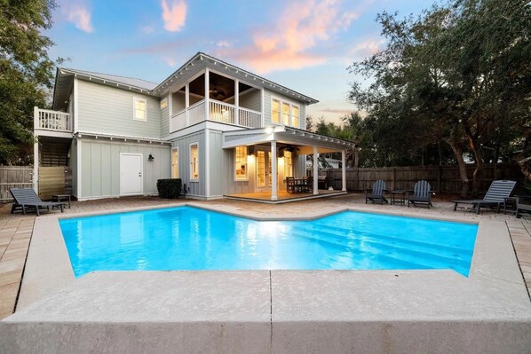A two-story house with a swimming pool, a covered patio, and a fenced backyard. - Sea Rest | Private Pool | Deeded Beach Access | 3 King Suites (Watersound Beach)