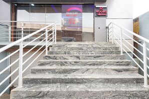 A staircase with marble steps leading to a room labeled 'AC ROOMS'. - FabHotel Gayathri Comforts (Bangalore)