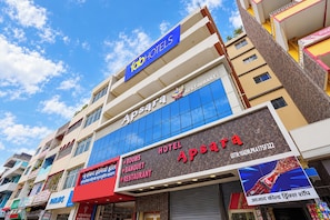 A hotel with a prominent sign for 'Apsara Hotel' and 'Rooms, Banquet, Restaurant' services. - FabHotel Apsara (Patna)