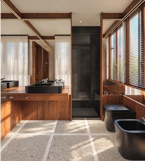 A modern bathroom with a wooden vanity, a large mirror, and a shower area. - The Couper Torretta (Roma)