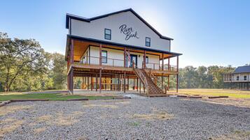A two-story building with a sign reading 'River Bank.'