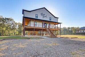 A two-story building with a sign reading 'River Bank.' - 'river Bank' Spacious Waterfront Group Getaway (Nashville)