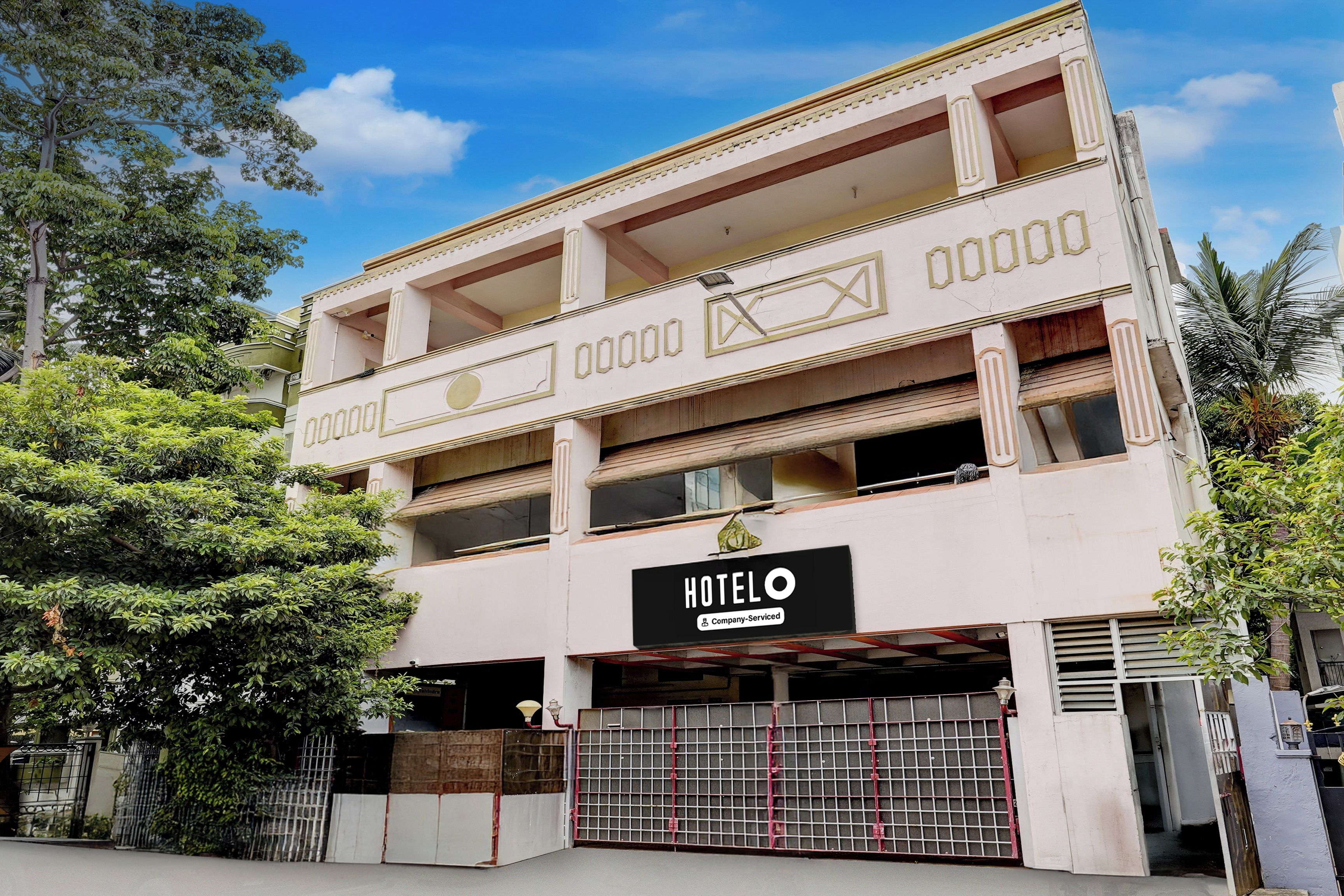 A multi-story building with a sign indicating it is a hotel.