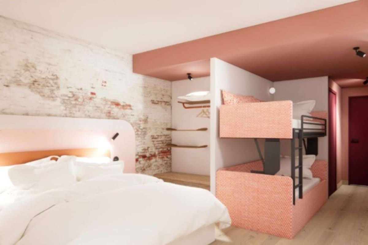 A bedroom with a bunk bed, a single bed, and a white headboard.