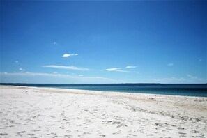 A beach with a clear sky and calm sea. - RAY'S ROOST WITH 6BD, 2 FULL KITCHENS, 2 LIVING AREAS, PERFECT FOR MULTI FAMILIE (Mexico Beach)