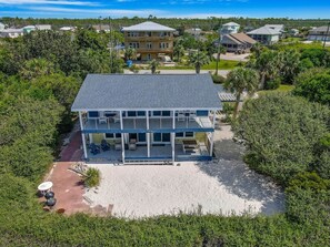 A two-story beachfront property with a covered patio and outdoor seating area. - "SALT WIND" HAS GULF VIEWS, STEPS TO BEACH, SECLUDED & PEACEFUL! (Mexico Beach)