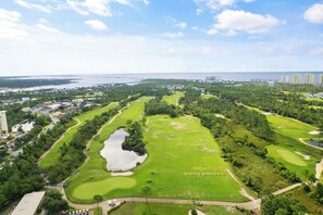 A golf course with multiple holes, a large pond, and surrounding greenery. - NEW LISTING!! Saltwater & Sunsets at Lost Key Golf & Beach Club (Perdido Key)