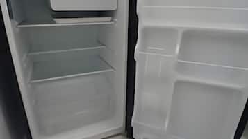 An open refrigerator with multiple shelves and compartments.