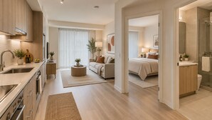 A modern apartment with a kitchen, living area, and bedroom. - Toronto Five Eight Suites (Toronto)