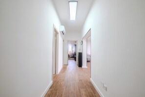 A corridor with a ceiling light, white walls, and wooden flooring. - A1 - luxury apartment near beach with big terrace and the sea view (Kaštel Gomilica)