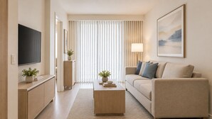 A modern living room with a flat-screen TV, a sofa, a coffee table, and a large window with vertical blinds. - Downtown Top Suites - S Avenue  (Toronto)