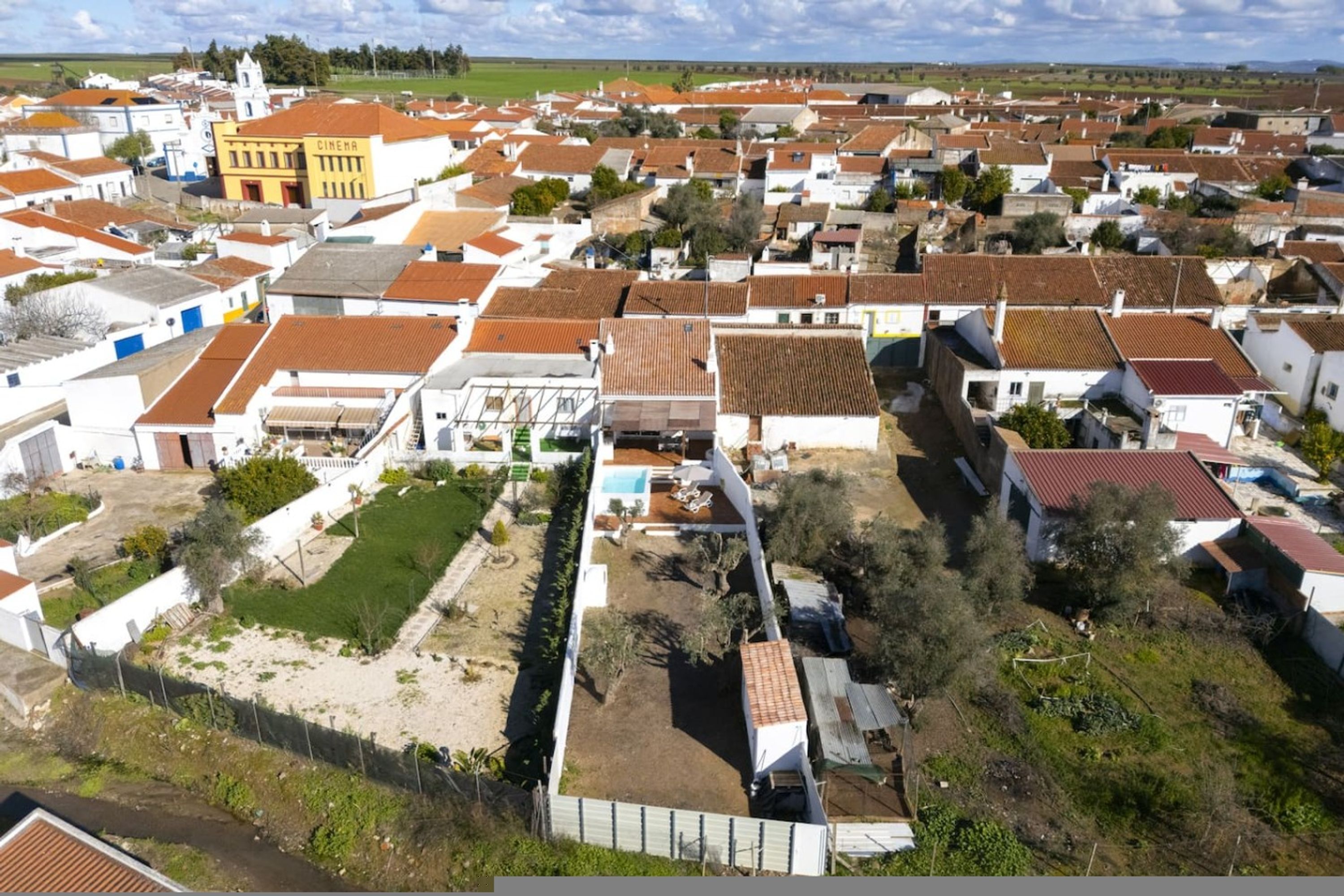 A residential area with houses, a cinema, and a church.
