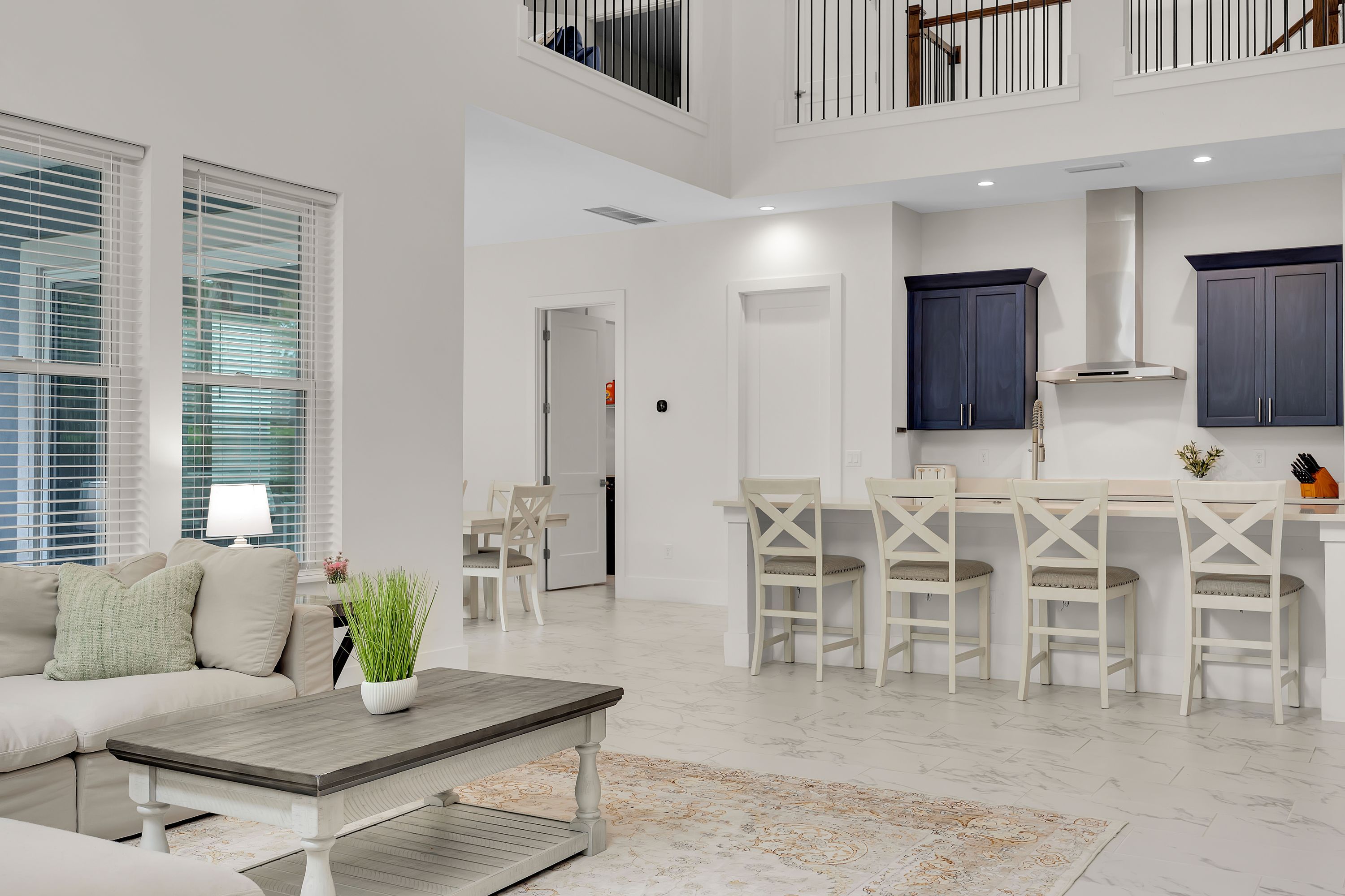 A modern interior with a dining area, kitchen, and living space.
