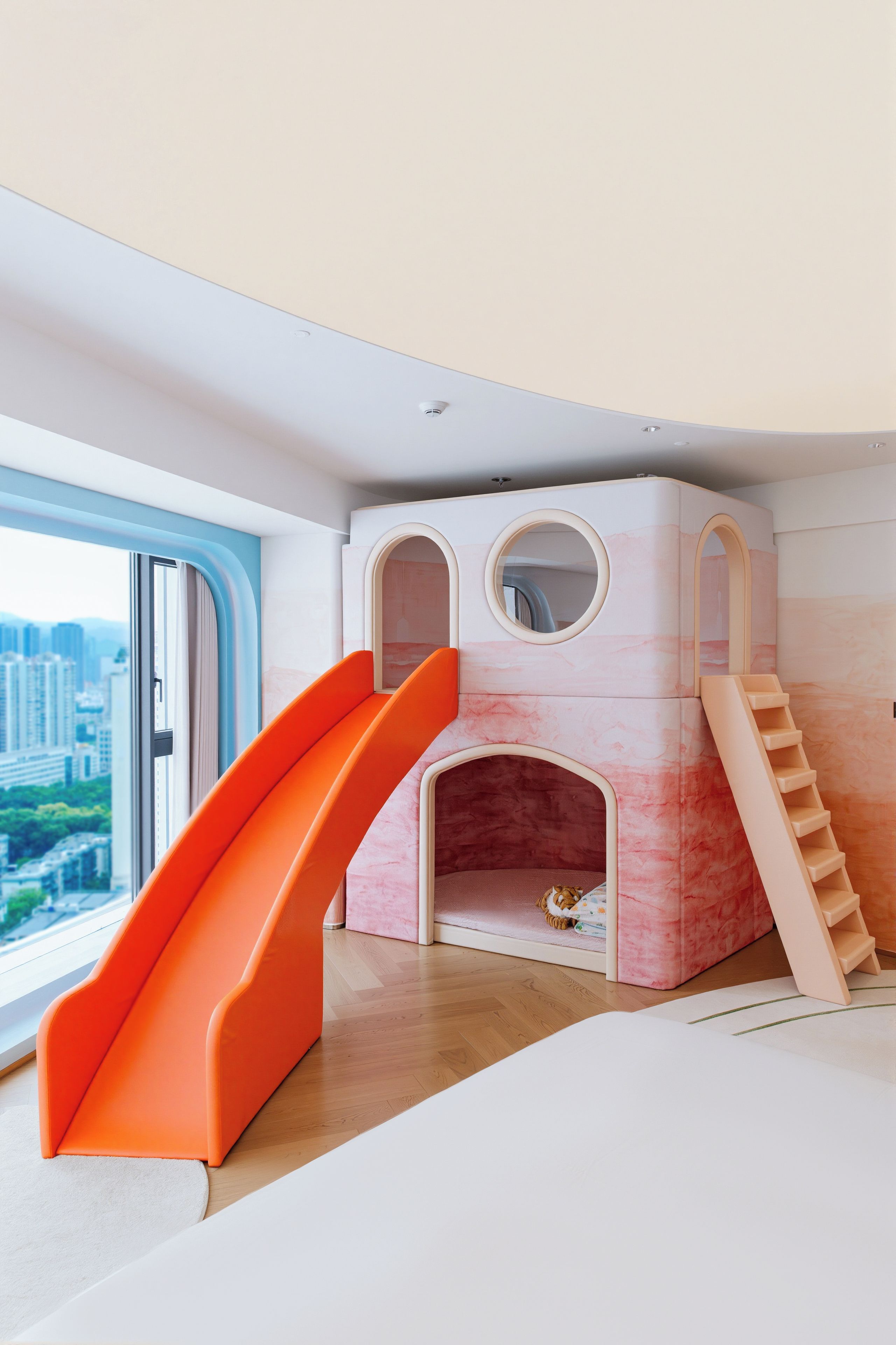 A children's play area with a slide and a climbing structure.