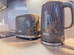 Two Daewoo appliances on a countertop. - Stylish 2BR Apt | Jewellery Quarter + Free Parking (Birmingham)