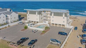 A beachfront hotel with a swimming pool, parking, and ocean views. - JL S-2C Sands Condos - Oceanfront - Community Pool (Kill Devil Hills)