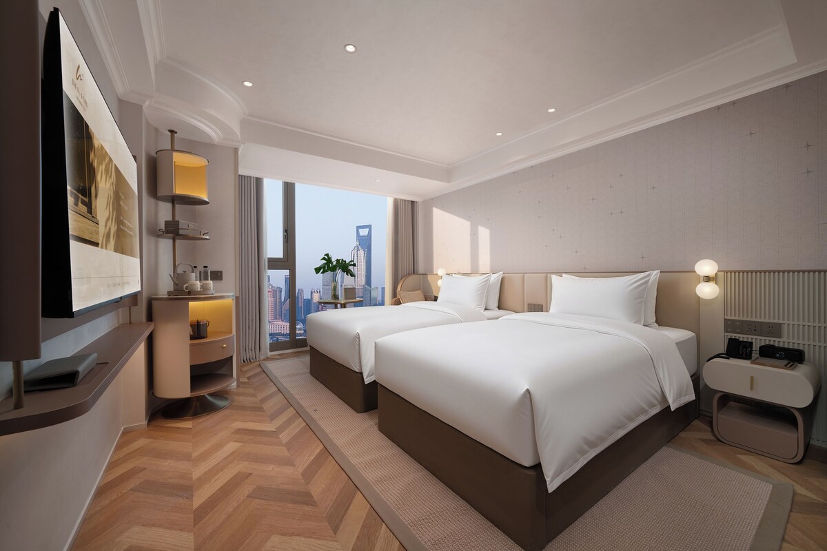 Tabla de planchar con plancha, wifi gratis y ropa de cama 