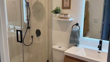 Shower, hair dryer, towels, soap