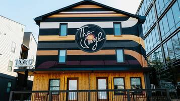 A building with a distinctive striped facade and a prominent logo.