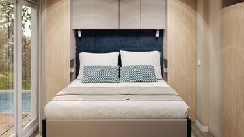Un dormitorio moderno con una cama grande, cabecero integrado y vista a una piscina.