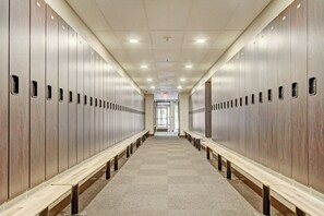 A long hallway with lockers on both sides and benches in the center. - Mountain Plaza Escape, Hot Tub, Parking, Mountain and Lake Views (Copper Mountain)