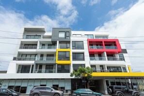 A multi-story building with balconies, large windows, and a flat roof. - Urban Stay in Trendy Windsor close to Chapel St (Windsor)