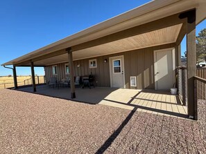 A covered outdoor area with a patio, seating, and a grill. - Ben's Place - A Quiet Sanctuary where you can enjoy sunrises and sunsets. (Sonoita)
