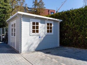 A small, single-story building with a white exterior, two windows, and a sign reading 'PANKERGLUCK'. - Holiday Home With 2 Bedrooms (Kellenhusen)