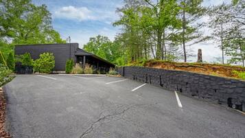 A parking lot with a building in the background.