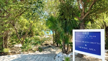 A sign for Villas at Blue Mountain, Private Beach Grotto, and Viewing Area.