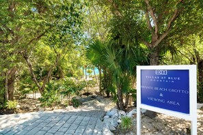 A sign for Villas at Blue Mountain, Private Beach Grotto, and Viewing Area.